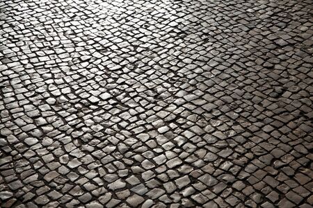 Street pavement of stones in the sunの写真素材