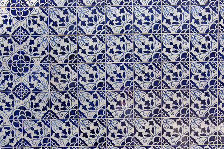 The wall of the house, faced with blue azulejo ceramic tiles
