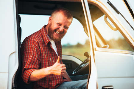 Cheerful driver shows that he is doing wellの写真素材
