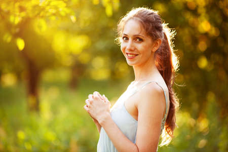 Beautiful happy young woman on a summer dayの写真素材