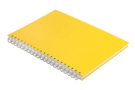 Yellow thick notepad with spiral on white backgroundの写真素材