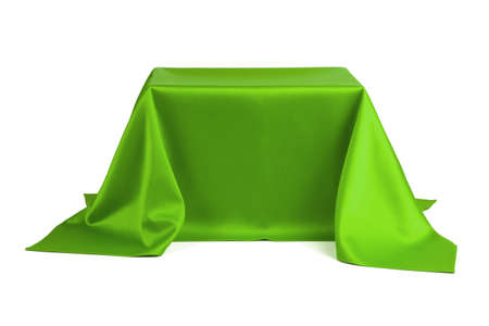 Something covered with green cloth on a white backgroundの写真素材
