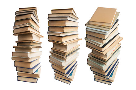 Photographed differently stacks of books on a white backgroundの写真素材