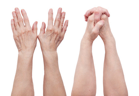 Hands of an old man in two angles on a white backgroundの写真素材