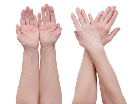 Hands of an old man on a white backgroundの写真素材