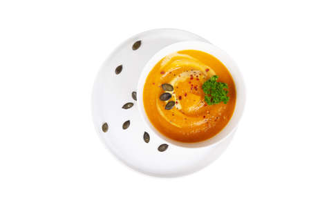 Bowl of pumpkin soup - mashed on a white dishの写真素材