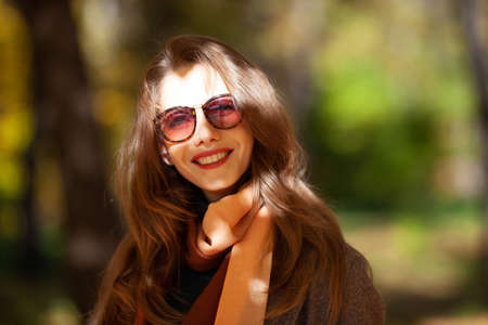 Portrait of a beautiful young woman in sunglassesの写真素材