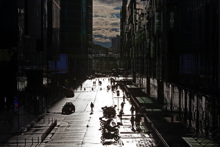 View of a city street with buildings on the sides on a sunny dayの写真素材