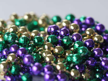 Close up photo of mardi gras beadsの写真素材