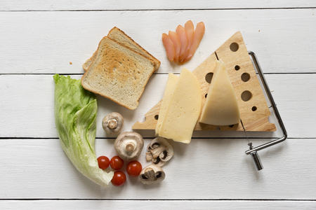 Ingredients for a sandwich on a white table for breakfast or lunの写真素材