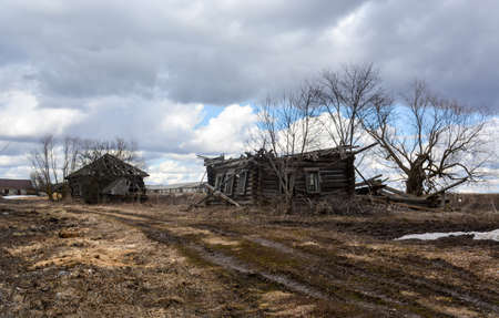 Sometimes villages are abandoned and destroyed wooden housesの写真素材