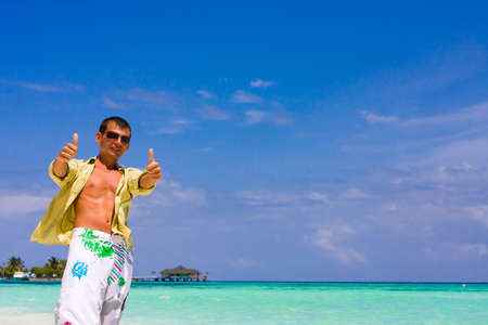 Young man with thumb upの写真素材