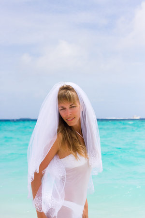Bride on a coastline at tropical beachの写真素材
