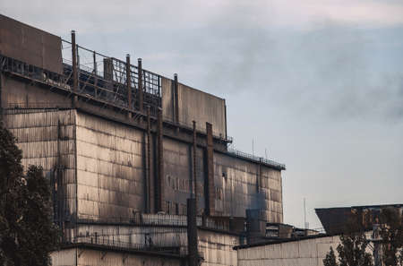 Working, old factory during production. Emissions of harmful substances into the atmosphere, pollution.の写真素材