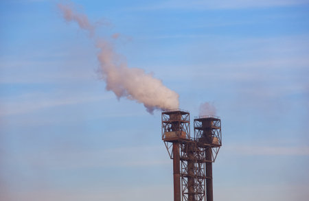 Working, old factory during production. Emissions of harmful substances into the atmosphere, pollution.の写真素材