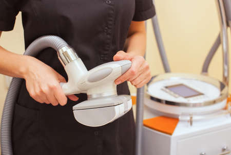 The masseur is preparing to make an  hardware massage in a beauty salon.の写真素材