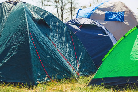 blue tents set tourists on the beach, on the sea coast.の写真素材
