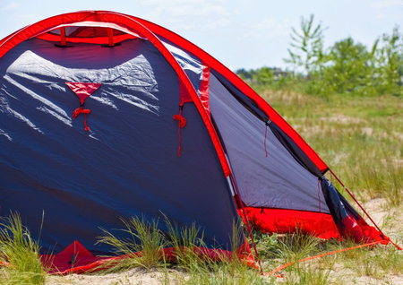 blue tents set tourists on the beach, on the sea coast.の写真素材