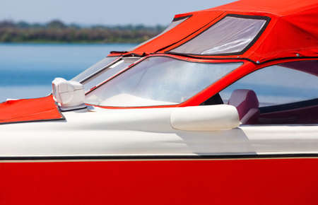 The red boat is at the berth moored on a summer day.の写真素材