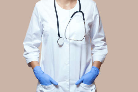 A girl doctor with a stethoscope close-up  in the clinic.の写真素材