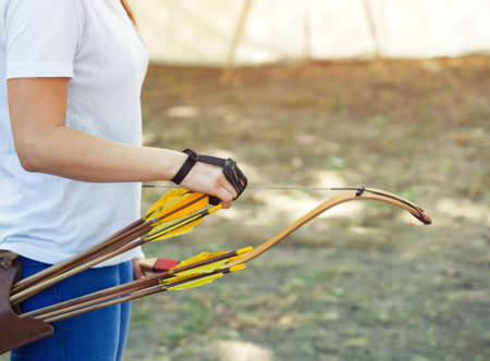 Athlete aiming at a target and shoots an arrow. Archery.の写真素材