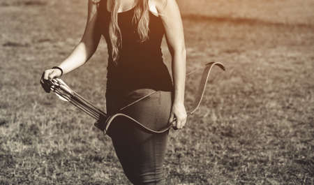 Athlete aiming at a target and shoots an arrow. Archery.の写真素材