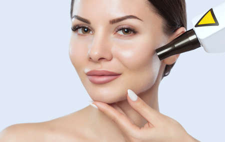 Carbon face peeling procedure in a beauty salon. Hardware cosmetology treatment.の写真素材