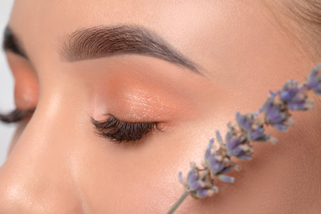 Eyes and eyebrows close-up.Portrait of a beautiful teenage girl with beautiful makeup, extended long...
