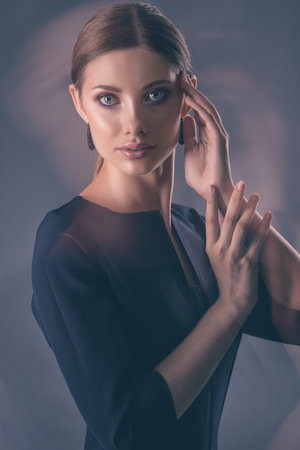 Portrait of a beautiful elegant girl in a suit. Double exposure.の写真素材