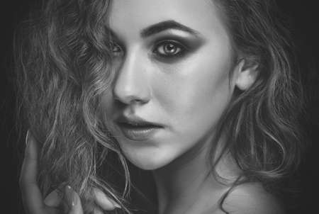Portrait of attractive girl with healthy clean skin and beautiful make-up. makeup concept.Black and white photoの写真素材