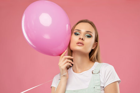 Portrait of attractive girl with healthy clean skin and beautiful make-up. Aesthetic cosmetology and...