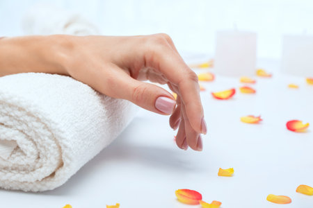 Woman's hand during a manicure in a beauty salon.の写真素材