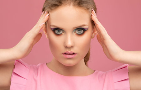Portrait of attractive girl with healthy clean skin and beautiful make-up. Aesthetic cosmetology and...