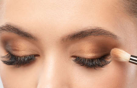 Portrait of a girl with beautiful makeup, extended long eyelashes and healthy clean skin. Makeup and cosmetology concept.の写真素材