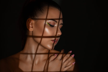 Portrait of attractive girl with healthy clean skin and beautiful make-up. Aesthetic cosmetology and...