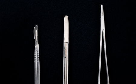 Sterile instruments on a black background close-up. Preparing instruments for surgery.の写真素材
