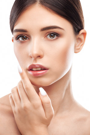 Portrait of attractive girl with healthy clean skin and beautiful make-up. Aesthetic cosmetology and makeup concept.の写真素材