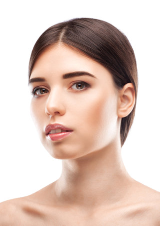 Portrait of attractive girl with healthy clean skin and beautiful make-up. Aesthetic cosmetology and makeup concept.の写真素材