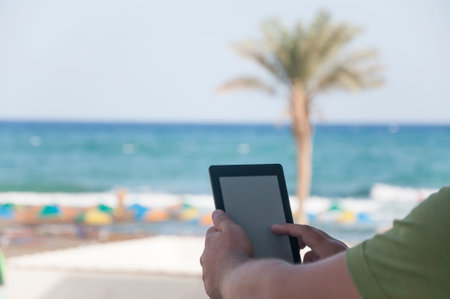 Man hands holding ebook reader