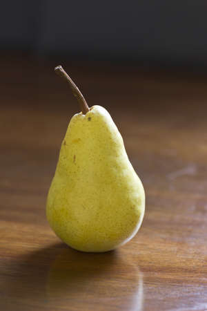 Pear on the wood background, natural lightの写真素材