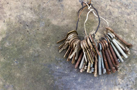 Set of old keys hanging on a ring of wireの写真素材