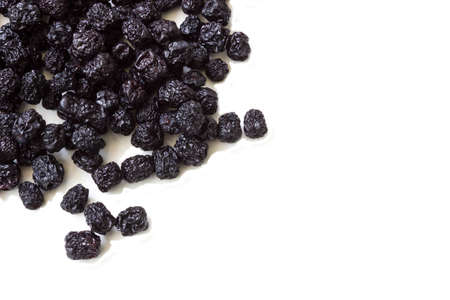 Dried chokeberry (aronia berry) on a white backgroundの写真素材