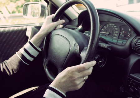 Female driving car. Vintage look