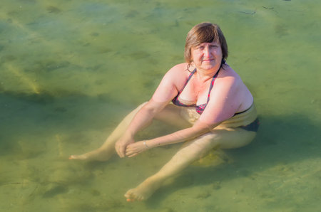 Woman sitting in the clear waters of the Black Sea