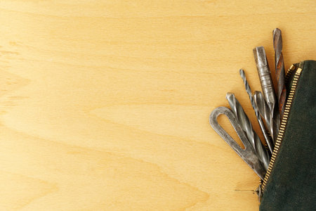 Old tools on wooden table surface. With copy space. Hobby in workshop, repairs work theme
