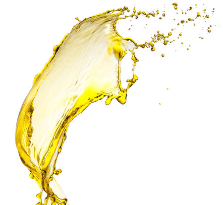 Flying splash yellow liquid on a white backgroundの写真素材
