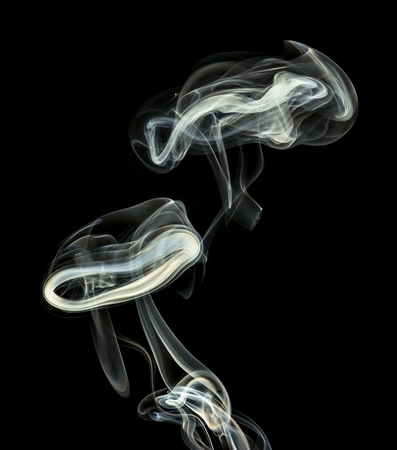 abstract white smoke isolated on a black の写真素材