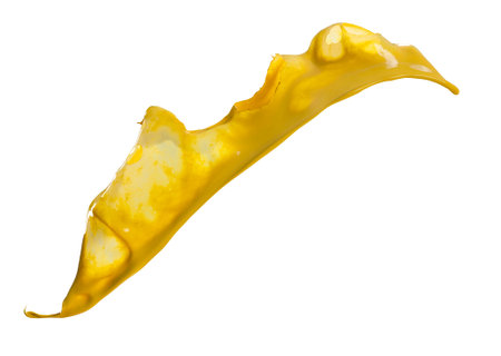 yellow paint splashes isolated on white backgroundの写真素材
