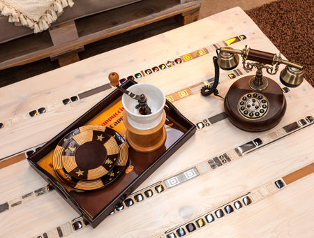 detail to the coffee table with a retro phone
