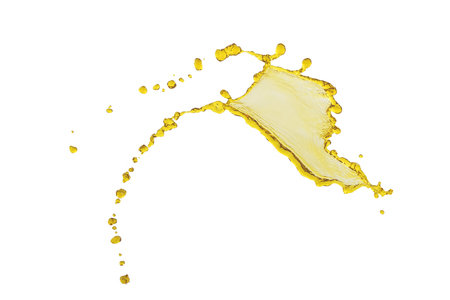 flying beautiful oil splah isolated over white background and dropsの写真素材